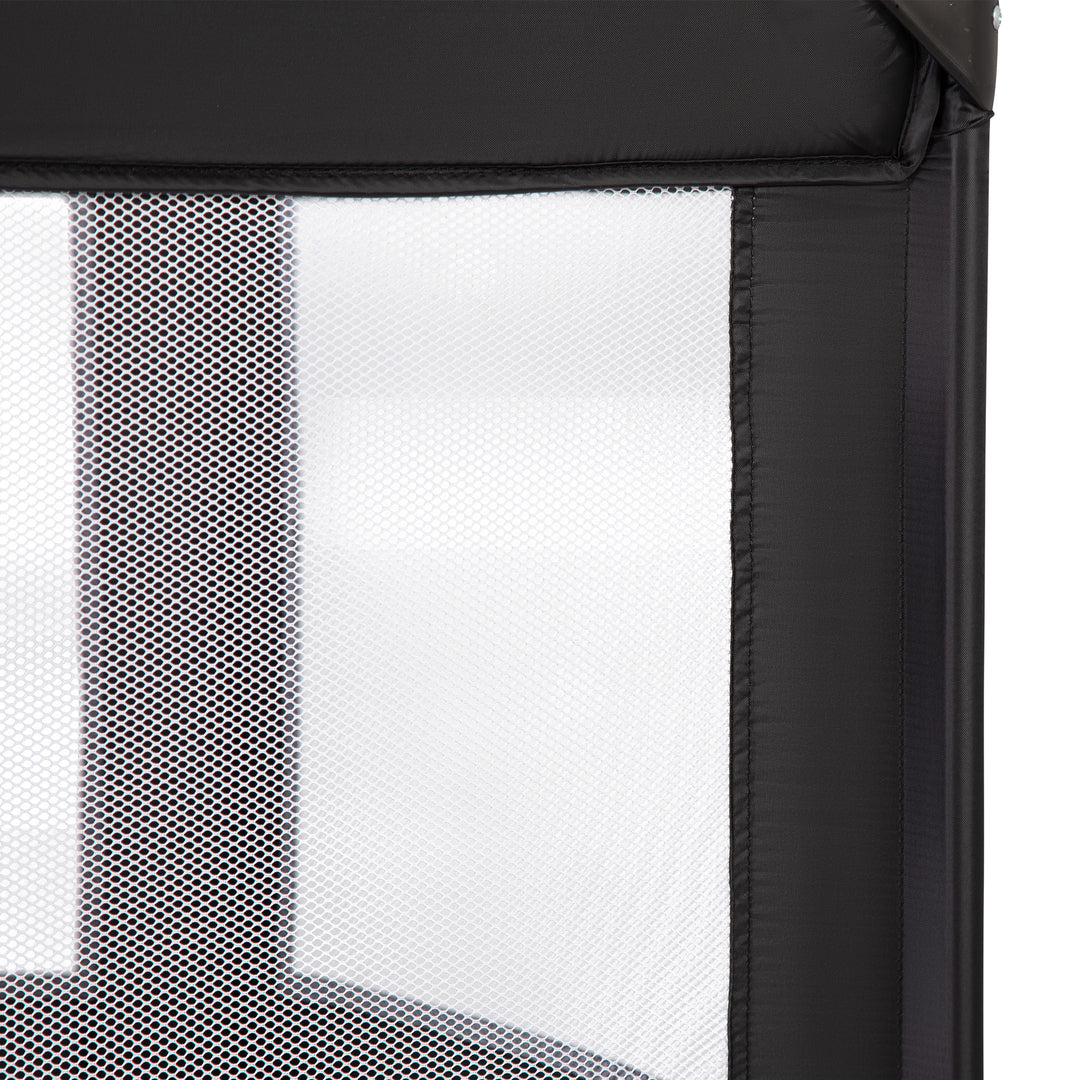 Red Kite Sleeptight Travel Cot in Black close up mesh detail
